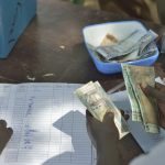 Photo of person counting money