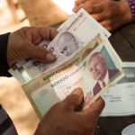 Image of someone counting cash