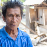 Mr. Mushki is a fisherman from Pantolowan village near Palu, Indonesia. He was out fishing when the earthquake struck, and the resulting tidal wave tossed him and his boat ashore, knocking him out and destroying the boat. ACT member Pelkesi's mobile clinic helps with treatment for his injuries. He hopes to get back to fishing again, as it is what he has done his whole life. Photo: Simon Chambers/ACT