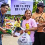 NCCP- ACT Alliance volunteers from local churches give food relief packs to affected families. 135 families received emergency assistance. Photo: Noe Cenal/ACT Philippines Forum