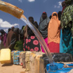 NCA in the field engaged in water distribution.